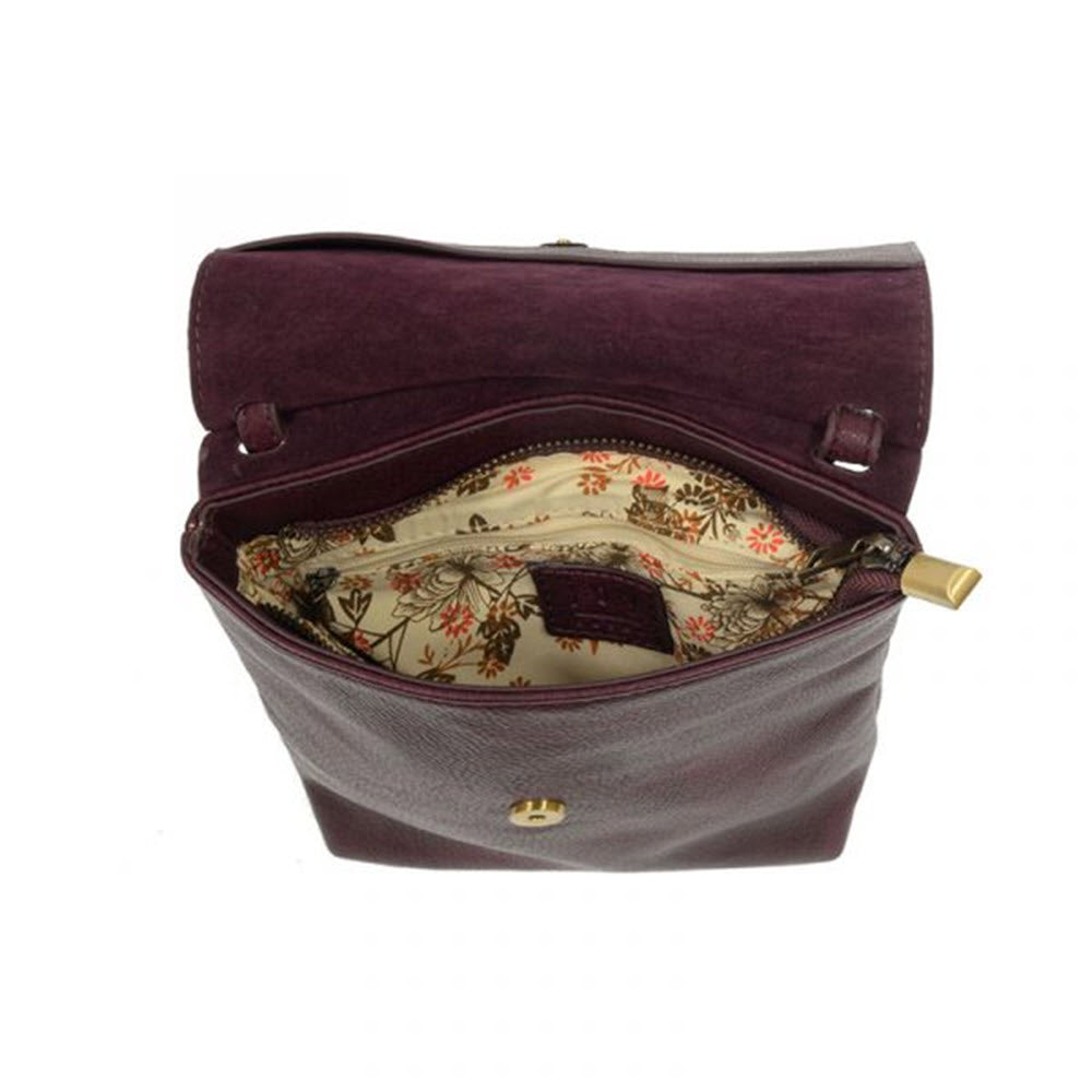 Open JOY SUSAN AIMEE FRONT FLAP CROSSBODY AUBERGINE with floral interior design and magnetic snap closure.