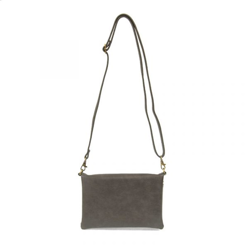 A gray Joy Susan Kitty Small Crossbody Bag Iron with a long, slim, metallic strap, isolated on a white background.