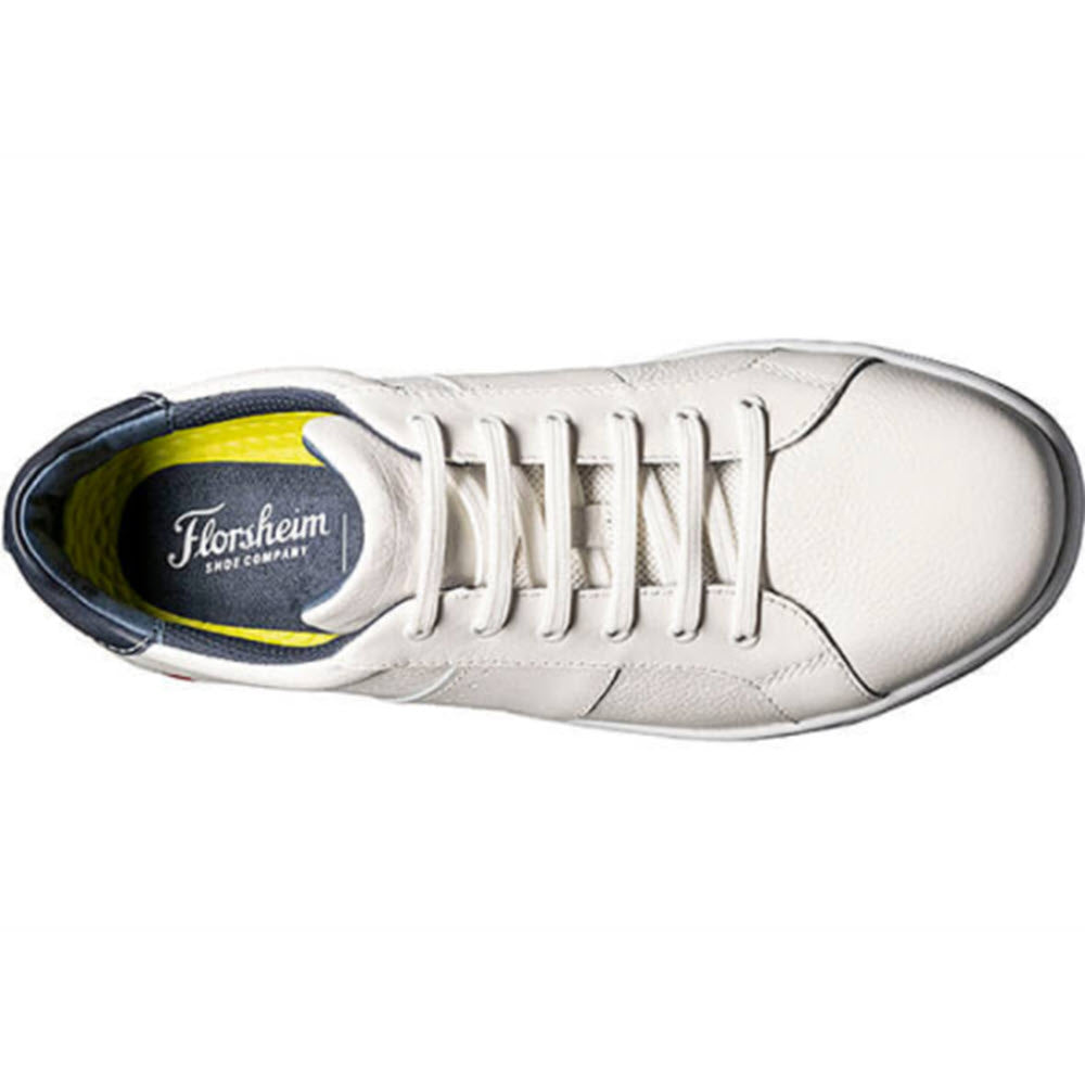 Top view of a Florsheim CROSSOVER LACE WHITE - MENS sneaker with laces and branded insole, featuring a natural leather upper.