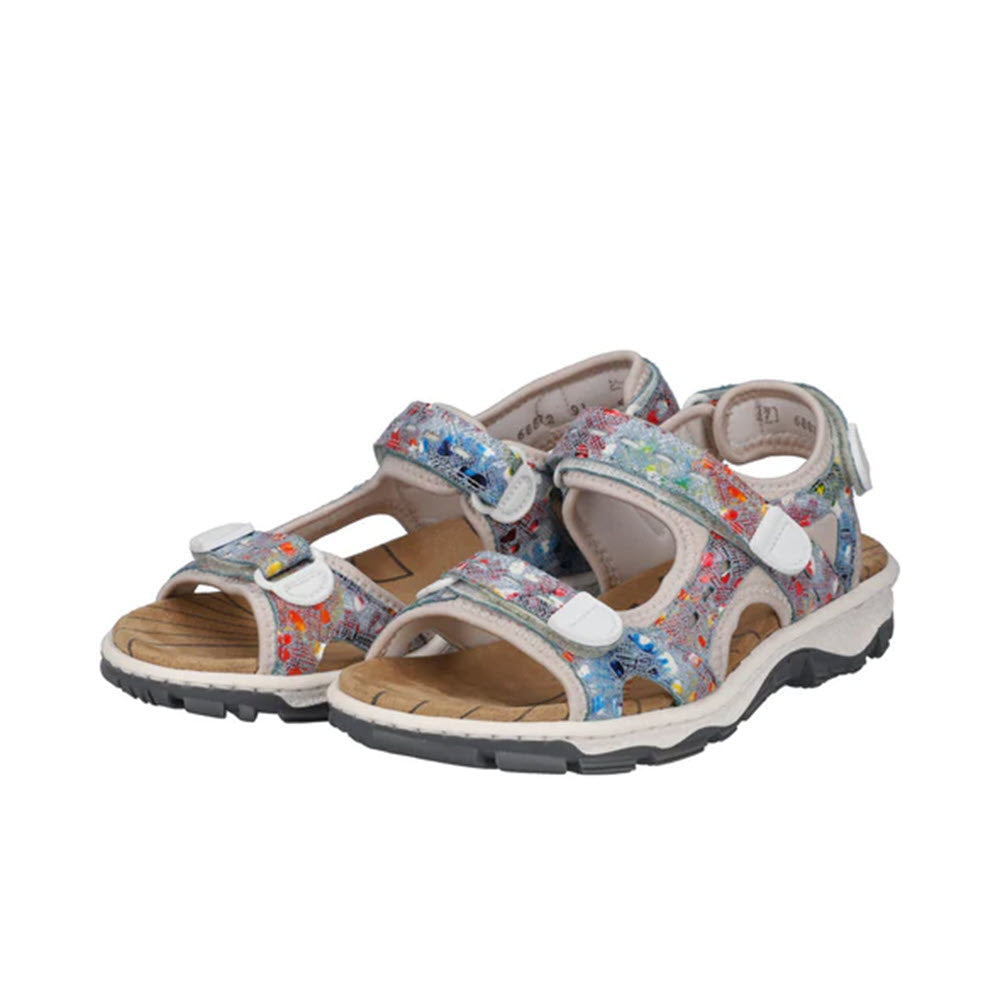 A pair of Rieker children&#39;s sandals with colorful floral patterns and adjustable straps, designed for light weight summer walking, isolated on a white background.