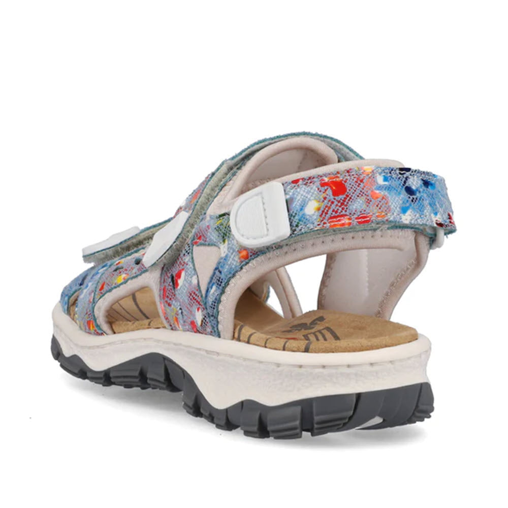 A colorful, floral-patterned Rieker Sport Sandal Floral Multi for Women with adjustable velcro straps and a chunky white sole, displayed on a white background.