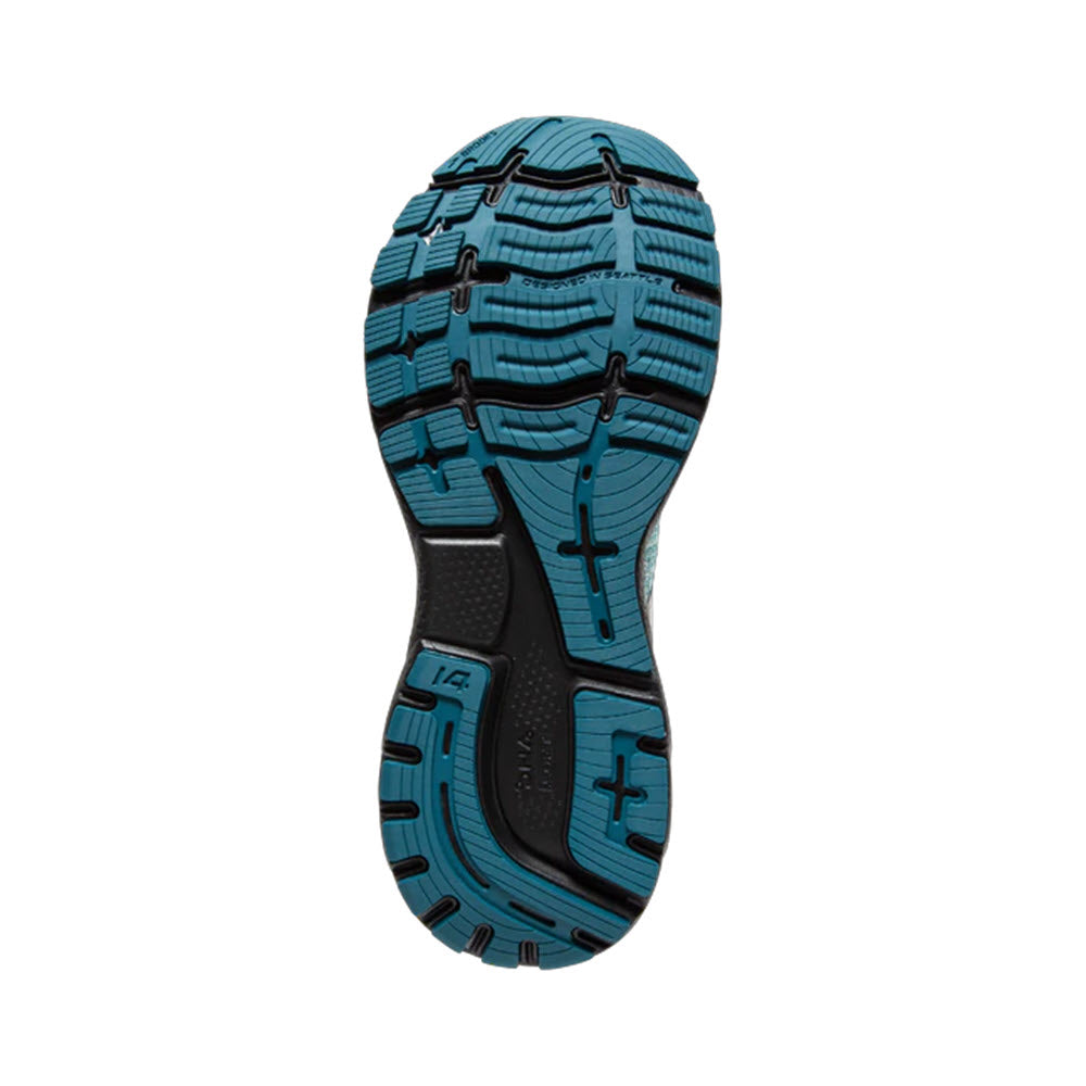 Tread pattern of a white, black and blue Brooks Ghost 14 women&#39;s running shoe sole.