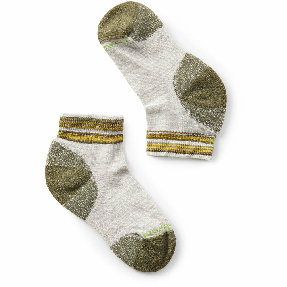 A pair of Smartwool Smartwool Kids Hike Light ankle-length socks with green heel and toe patches and a yellow, green, and white striped pattern at the cuff, displayed on a white background.