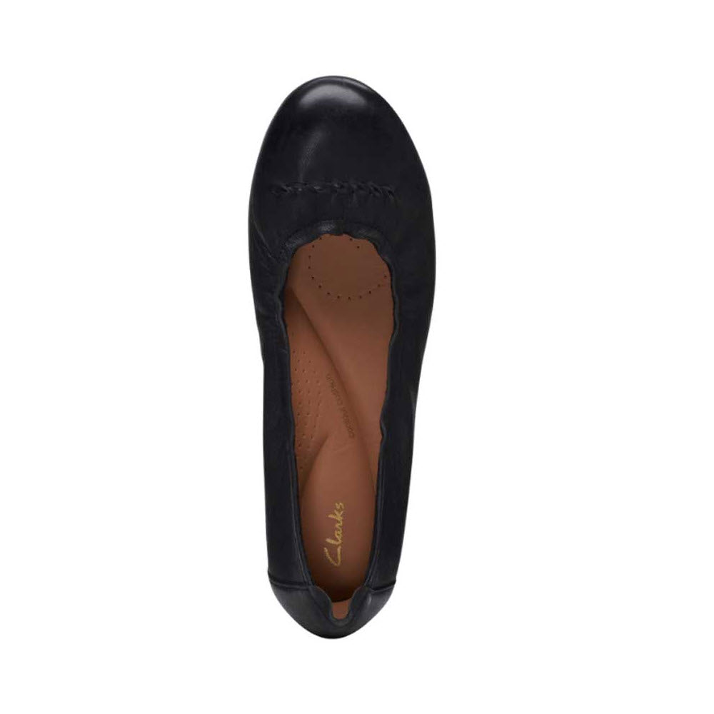 Top view of a black leather Clarks Rena Hop ballet flat with a round toe and decorative stitching.