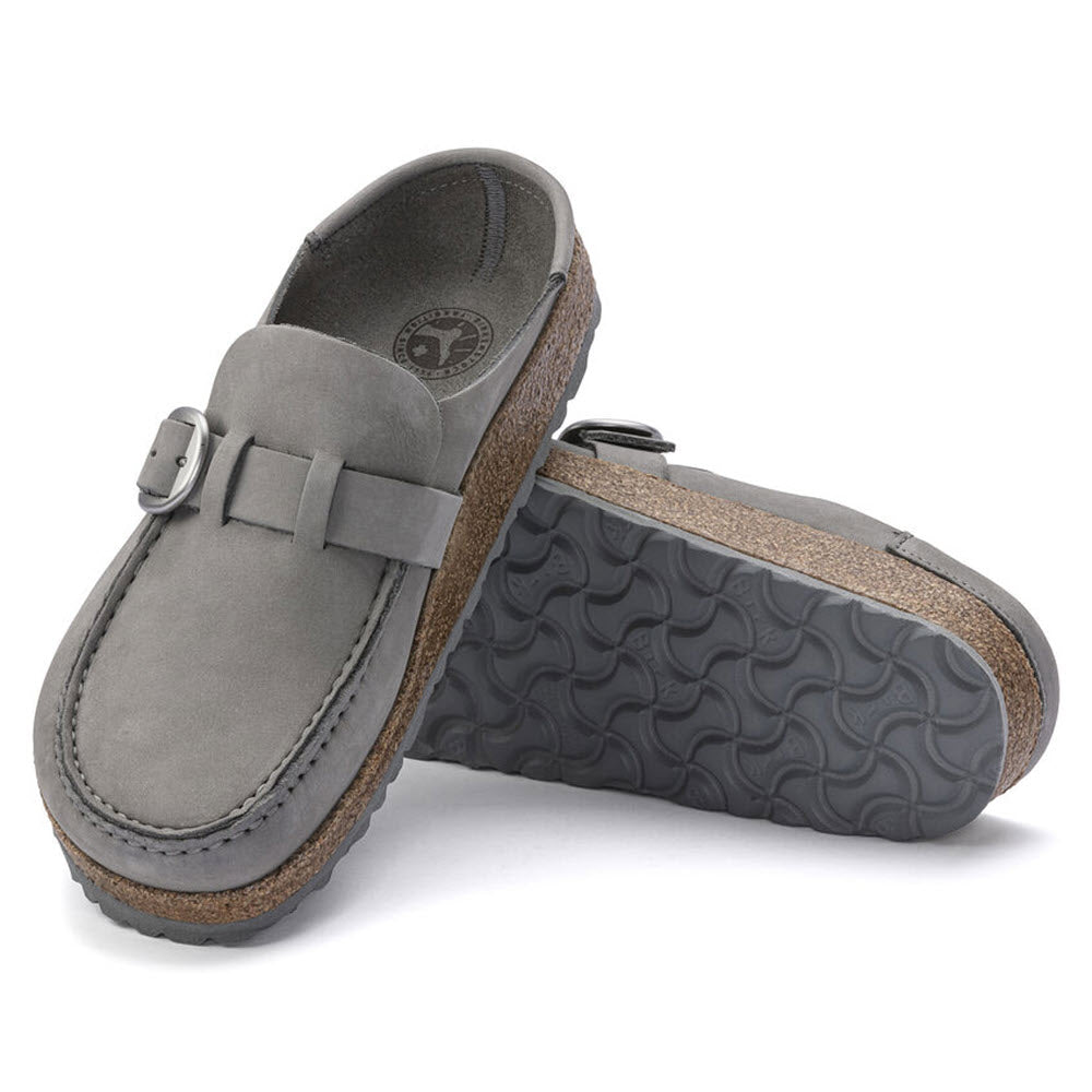 A pair of Birkenstock Buckley Dove Grey Nubuck loafers with a buckle detail, displayed against a white background.