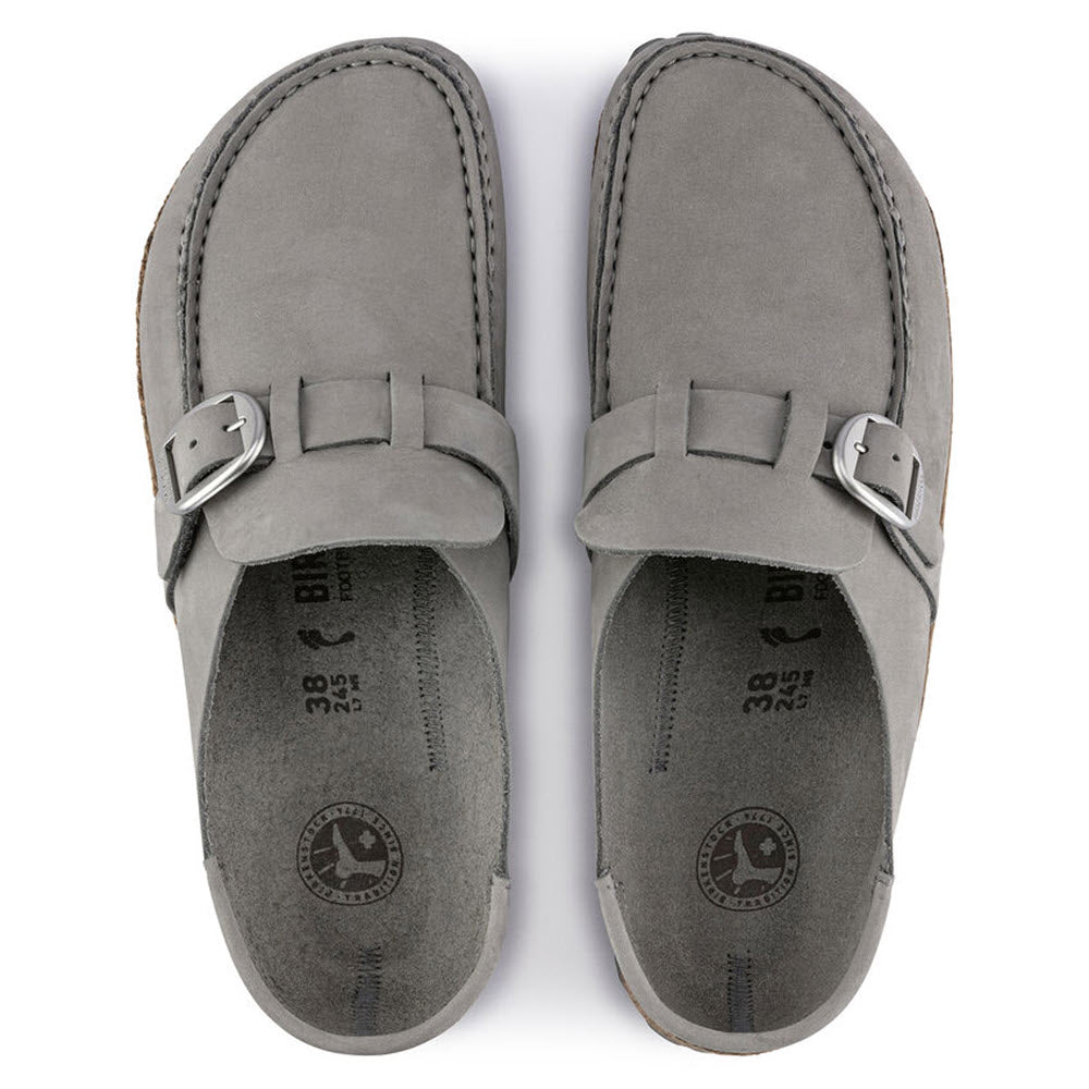 Top view of a pair of Birkenstock Buckley Dove Grey Nubuck loafers with silver buckles, showcasing visible Birkenstock brand imprints on the insoles.