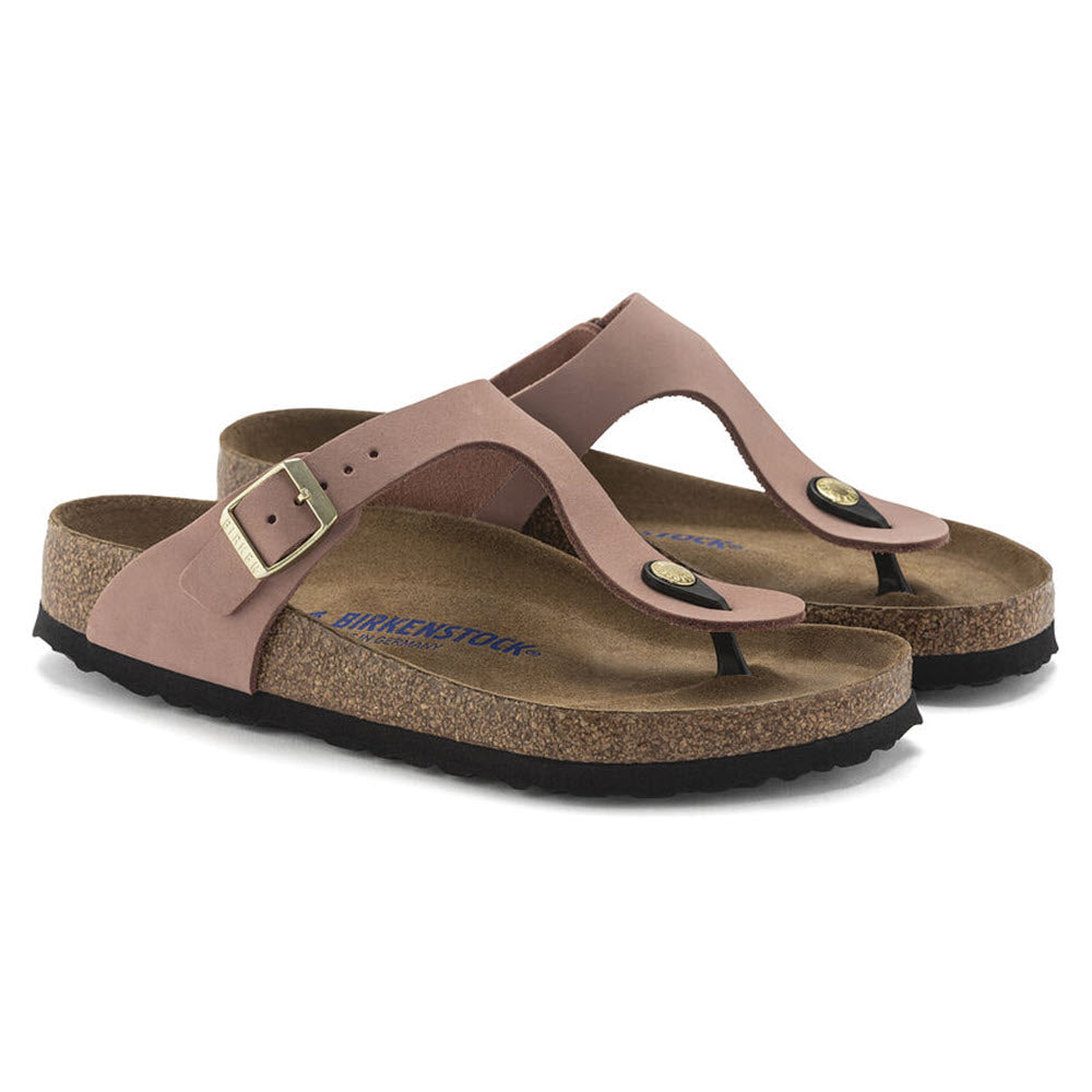 A pair of Birkenstock Gizeh Old Rose Nubuck thong sandals with brown straps and cork footbeds, isolated on a white background.
