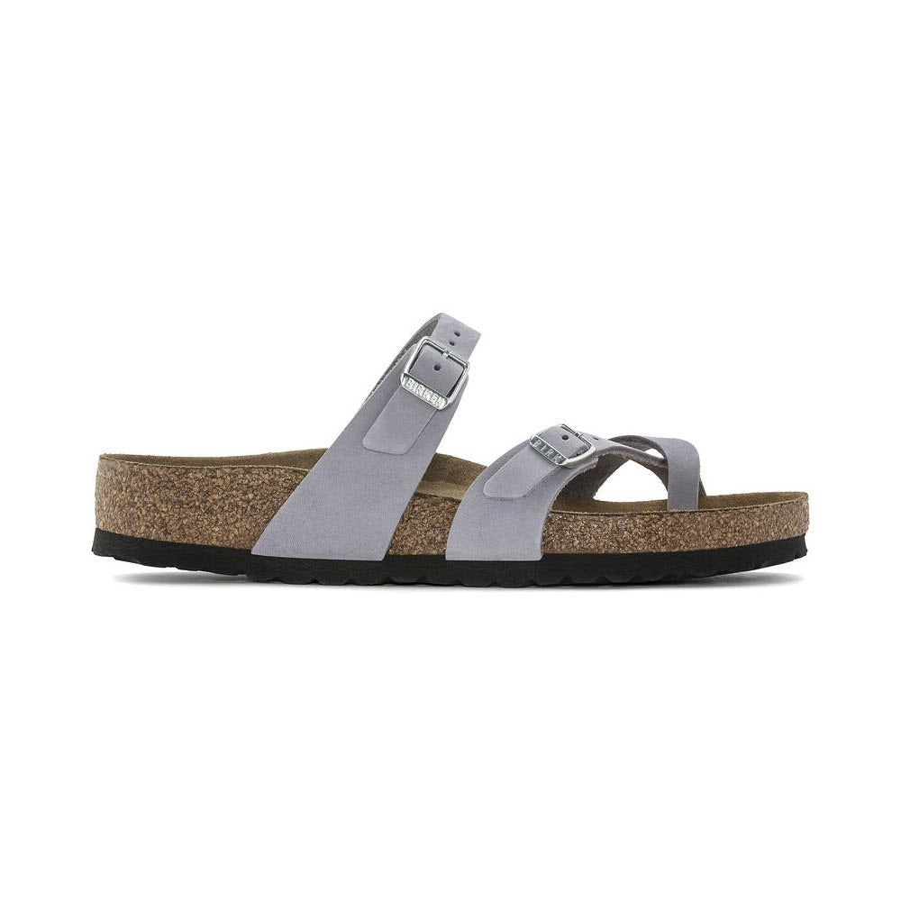 A pair of Birkenstock Mayari Purple Fog Nubuck thong sandals with buckles on a white background, featuring a cork sole and a single strap over the toe.