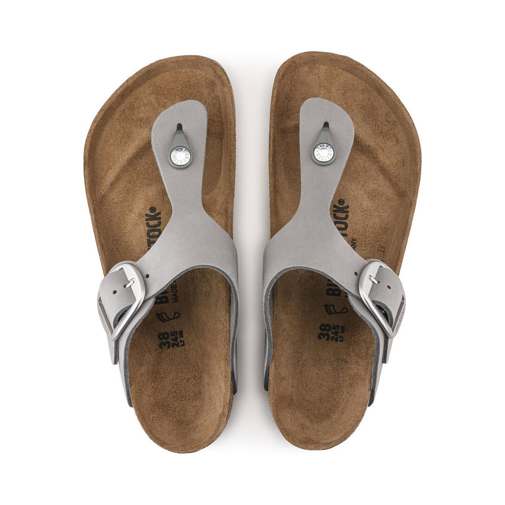 A pair of brown Birkenstock Gizeh Big Buckle Dove Grey Nubuck sandals with adjustable silver buckles, viewed from above.