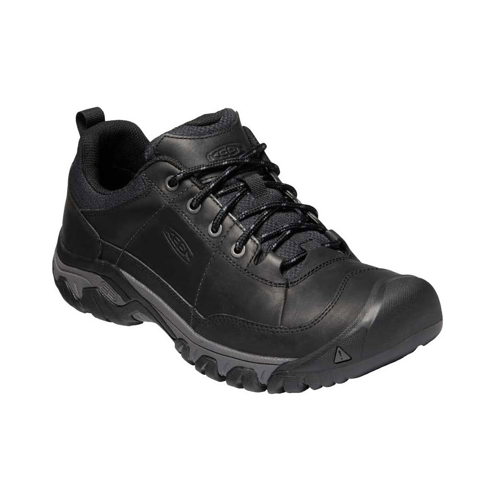 A single Keen Targhee III Oxford Black Magnet - Mens hiking shoe featuring premium leather uppers, with a thick rubber sole, lace-up front, and a loop on the heel for easy wearing.