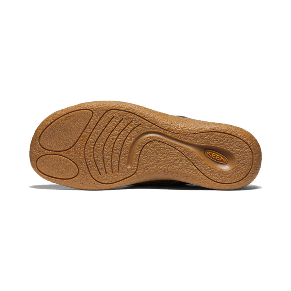 Bottom view of a brown soft-yet-grippy outsole of a shoe with textured design and the logo &quot;KEEN&quot; embossed.