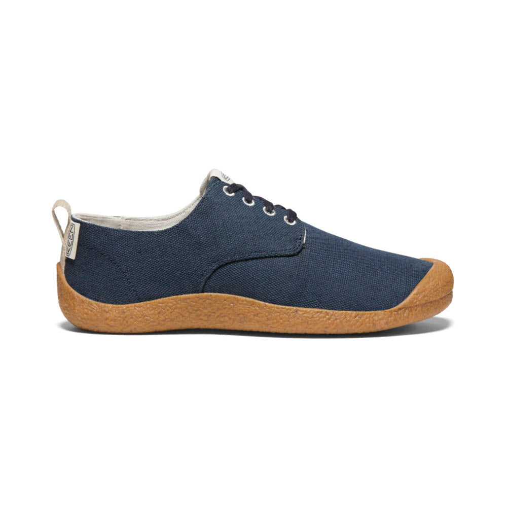 Side view of a Keen Mosey Derby Canvas Sky Captain - Mens shoe with a cork sole and white laces, isolated on a white background.
