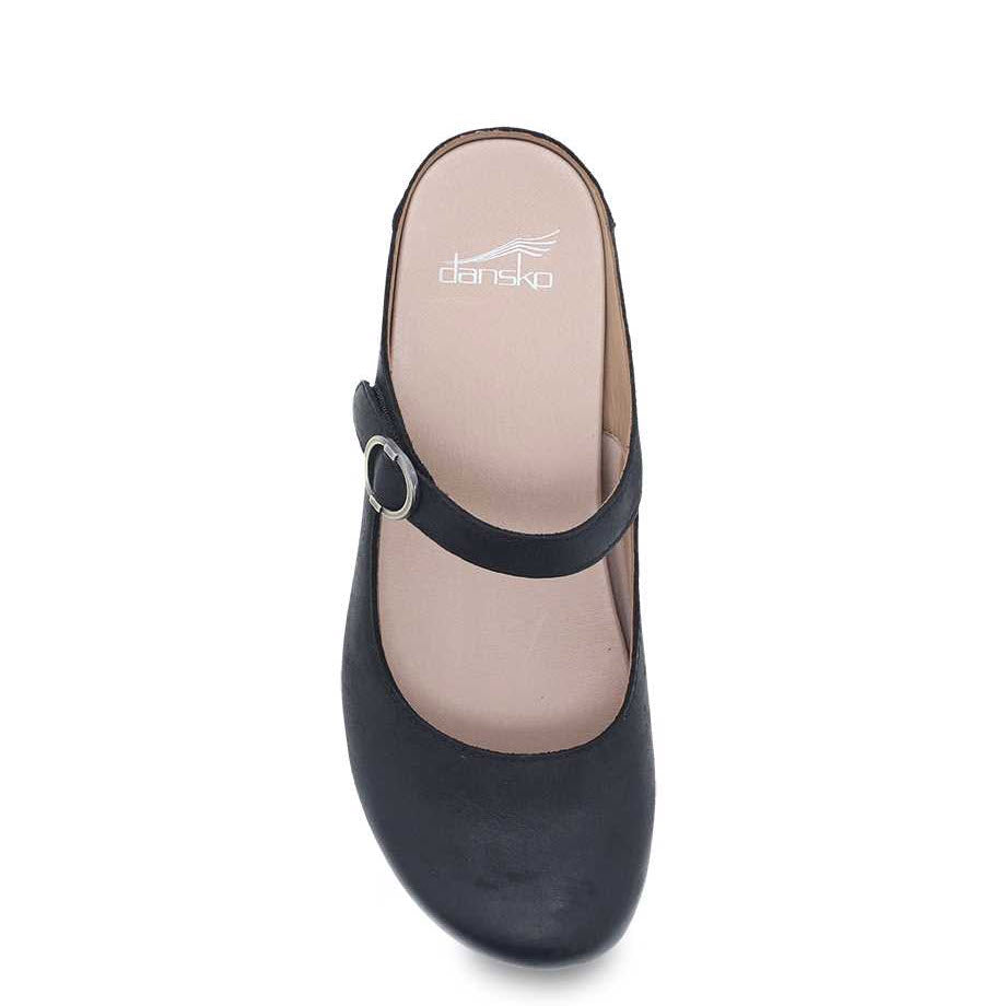 A black Dansko Bria women&#39;s Mary Jane shoe with a single strap over the instep, treated with 3M Scotchgard protector, viewed from above on a white background.