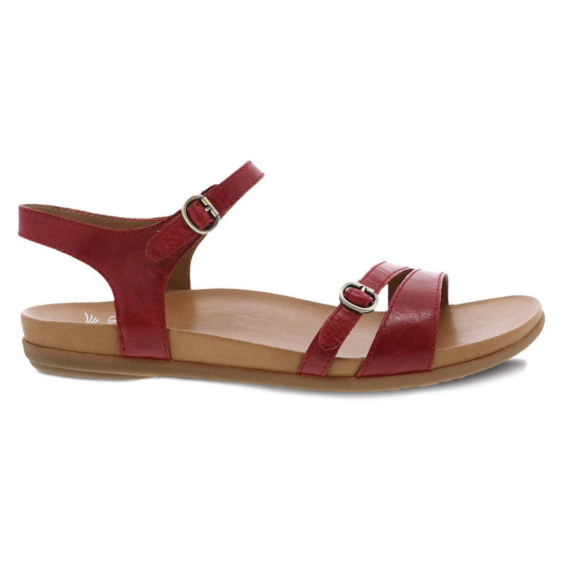 A single Dansko Janelle Red Glazed sandal with two straps, each fastened by adjustable closures, displayed against a white background.