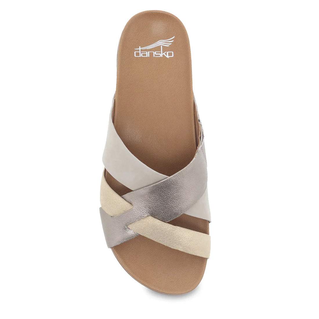 A top-down view of a Dansko Joanna Sand Multi - Womens sandal, featuring crisscrossed beige and silver leather uppers on a brown footbed.