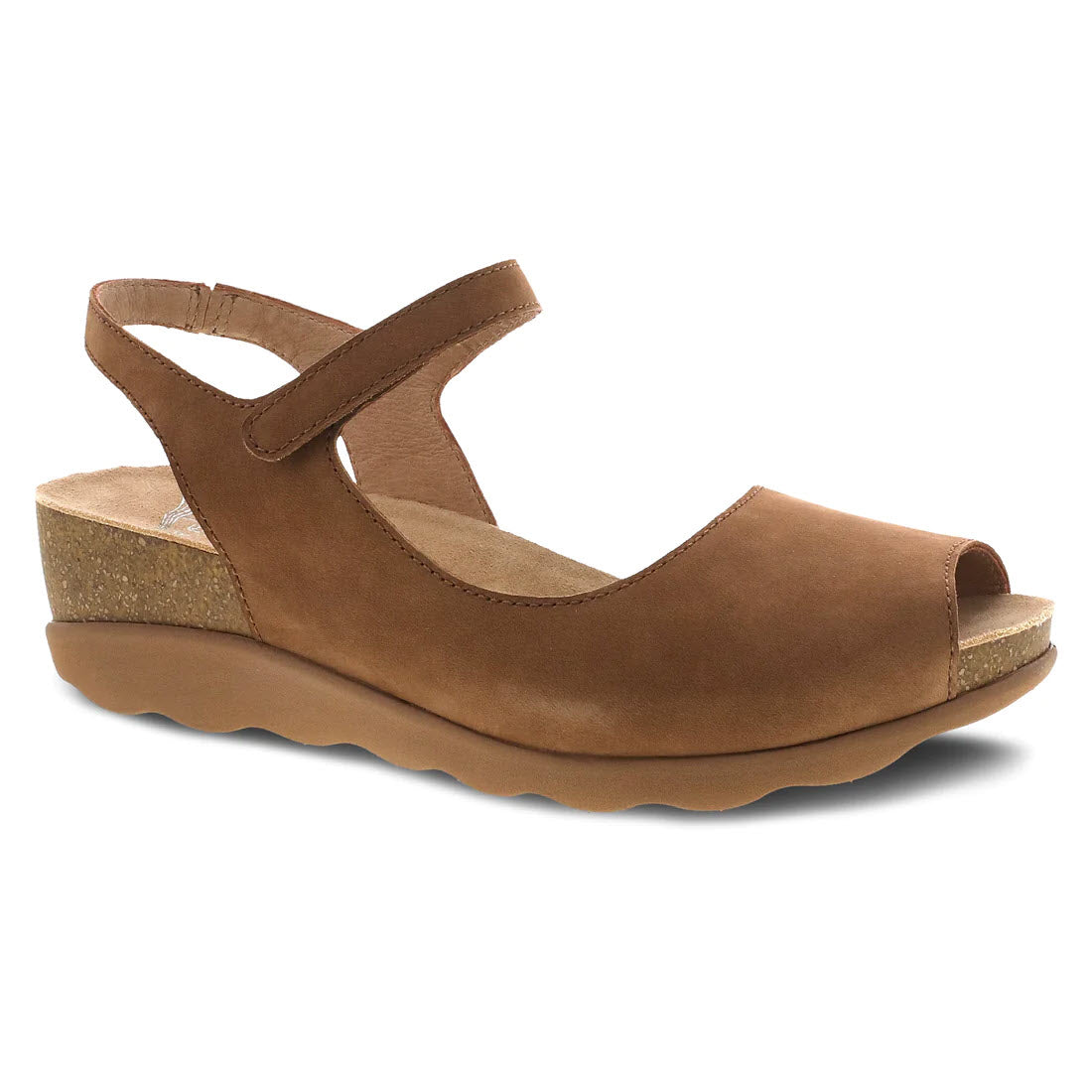 A brown suede Dansko Marcy Wedge sandal with an adjustable ankle strap and cork heel, isolated on a white background.