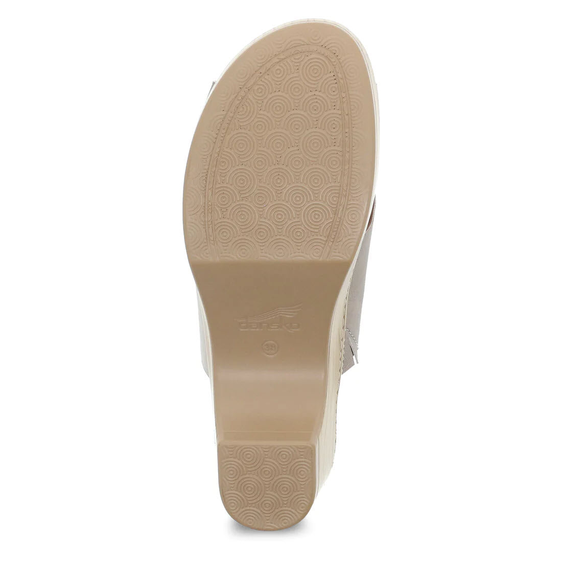 Sole of a light brown Dansko Miri Sand Multi slide sandal with circular patterns and brand logo embossed near the heel.