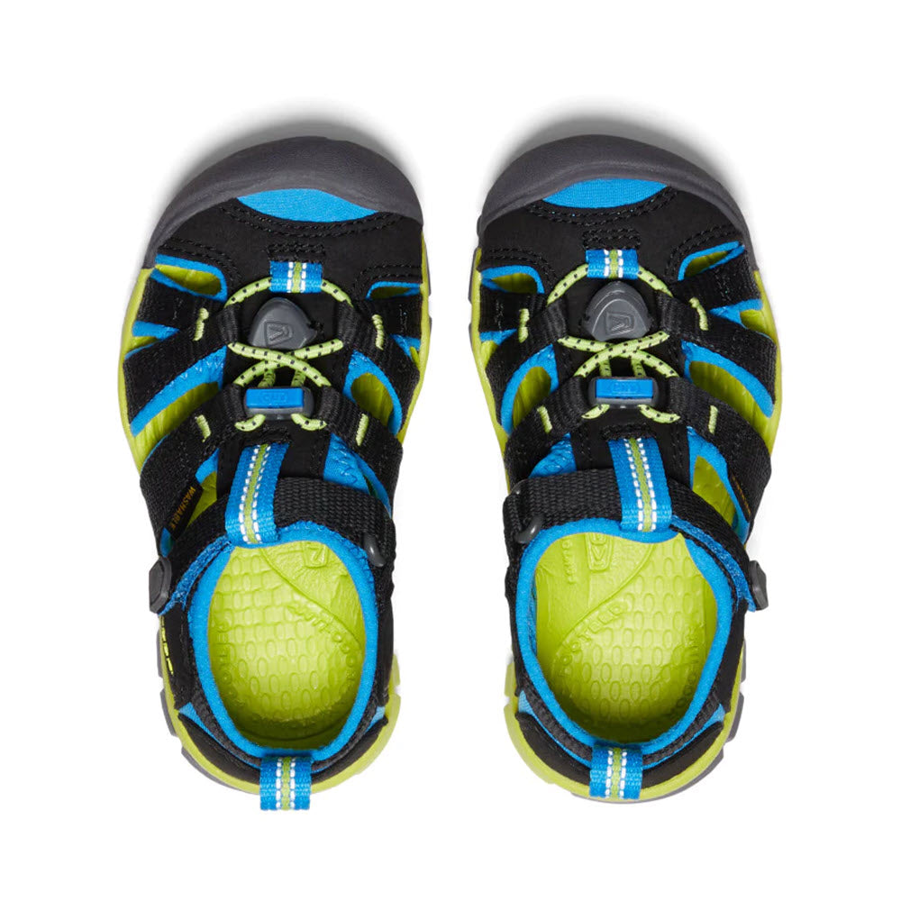 A pair of brightly colored Keen® Child Seacamp II CNX Black/Blue - Kids children&#39;s shoes with black, blue, and neon green details, viewed from above.