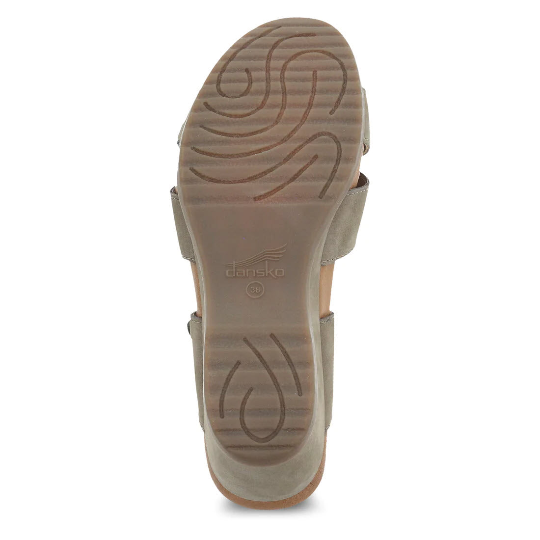 Bottom view of a beige Dansko sandal showing the leather wrapped contoured EVA footbed and brand logo.