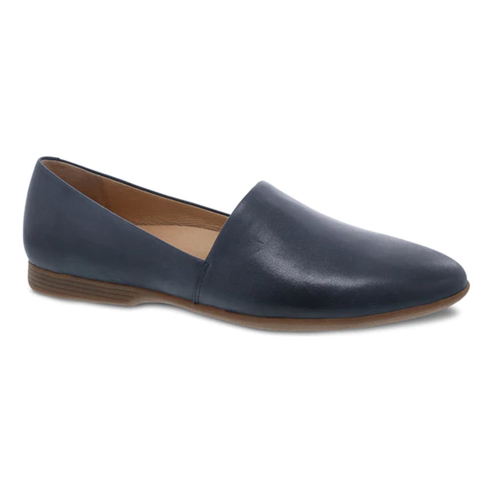 A navy blue Dansko Larisa slip-on flat with leather uppers, a low heel, and a closed, rounded toe on a white background.