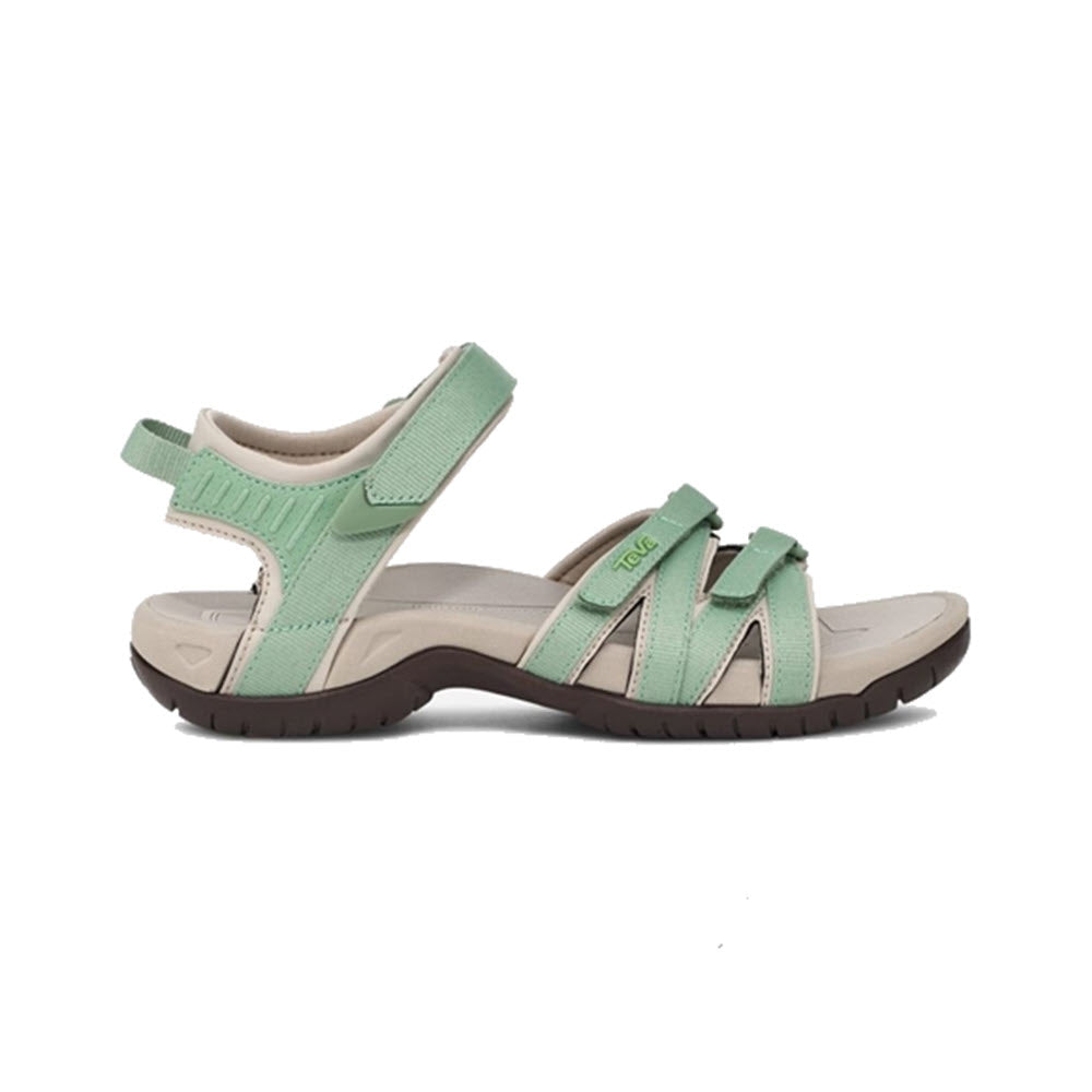 A single light green women's Teva Tirra Basil sport sandal with velcro straps and a brown sole, displayed against a white background.