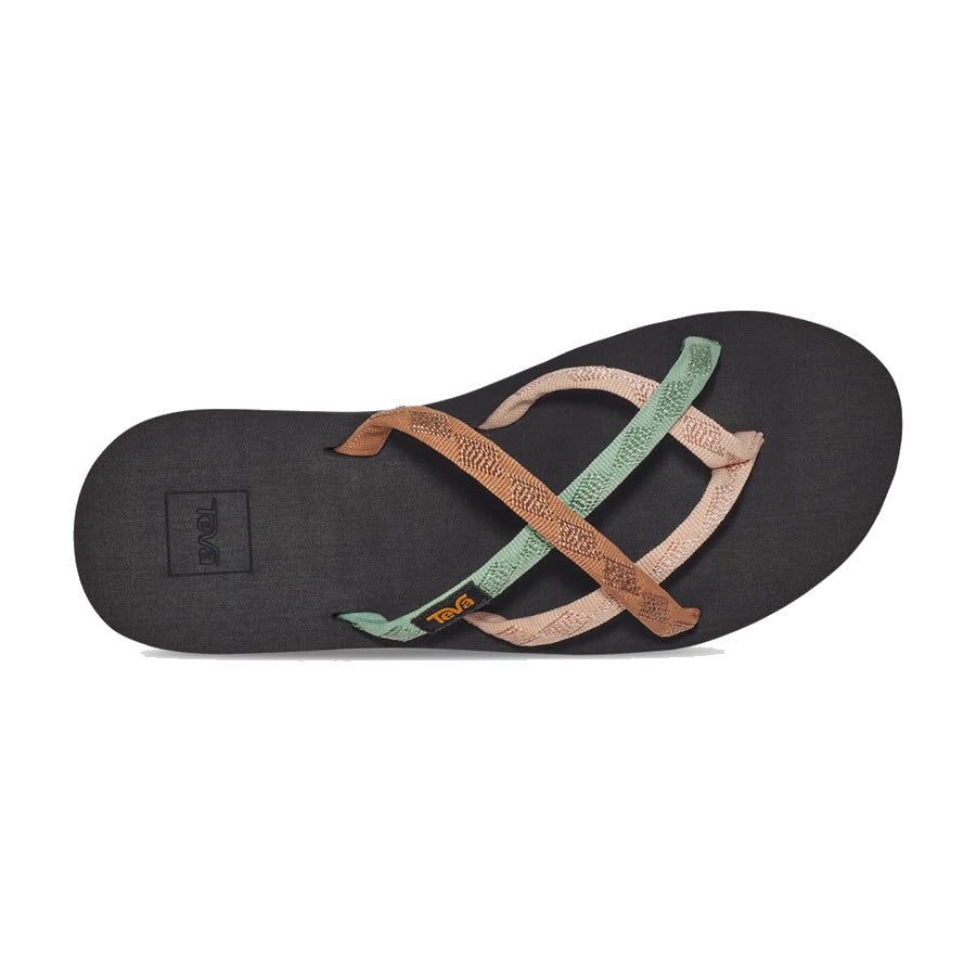 A pair of Teva Women’s Olowahu Maple Sugar Multi flip-flops with teal and brown straps overlaid on a black footbed, viewed from above.