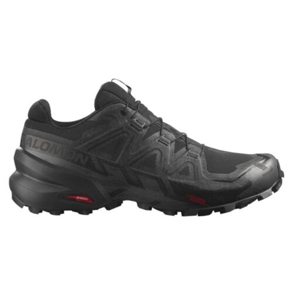A single black Salomon Speedcross 6 GTX trail running shoe with red accents on the sole, featuring prominent Salomon logos and a rugged tread design.