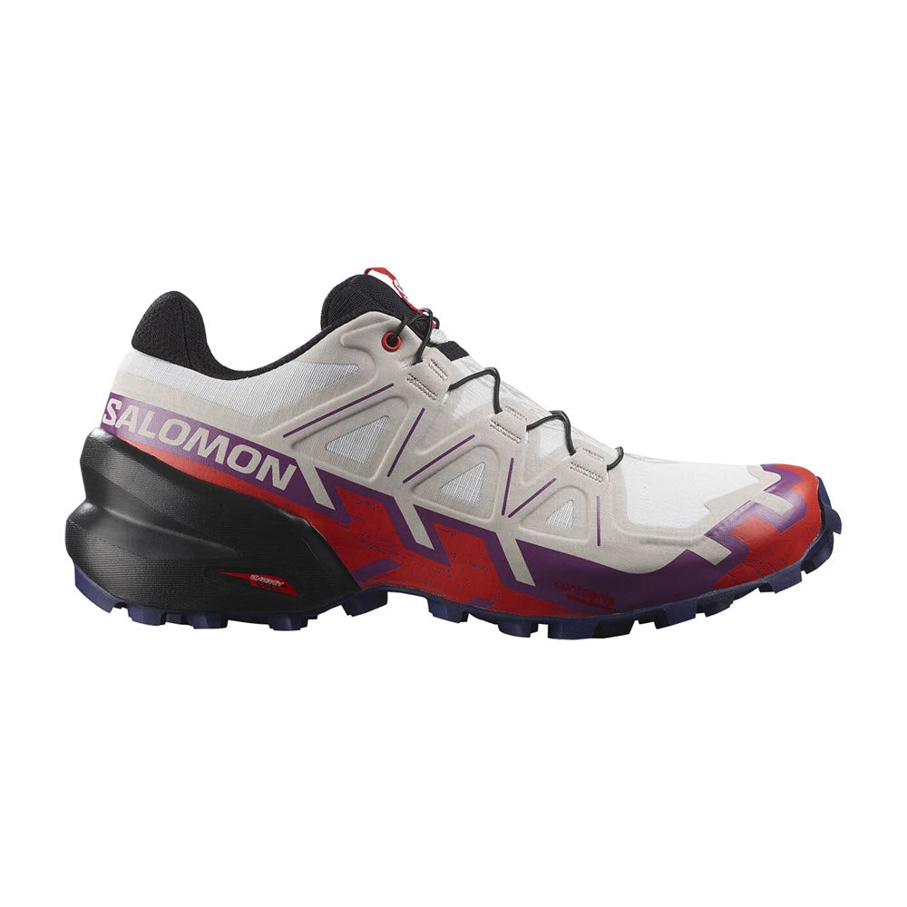 A Salomon SPEEDCROSS 6 WHITE/SPARKLING GRAPE trail running shoe, featuring prominent branding and a rugged sole designed for mud evacuation.