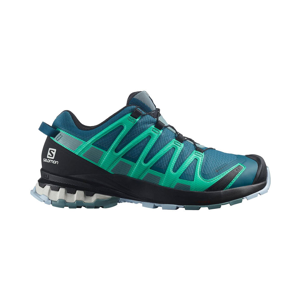 A Salomon XA Pro 3D V8 GTX Legion Blue trail running shoe in teal and dark blue with a black sole and white logo on the side.
