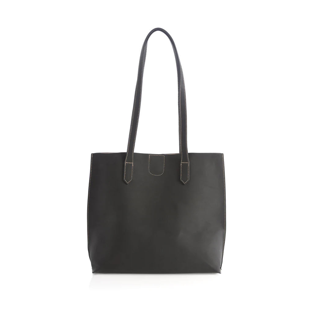 A Shiraleah black leather tote bag with long handles and an outer slip pocket, standing upright against a white background.