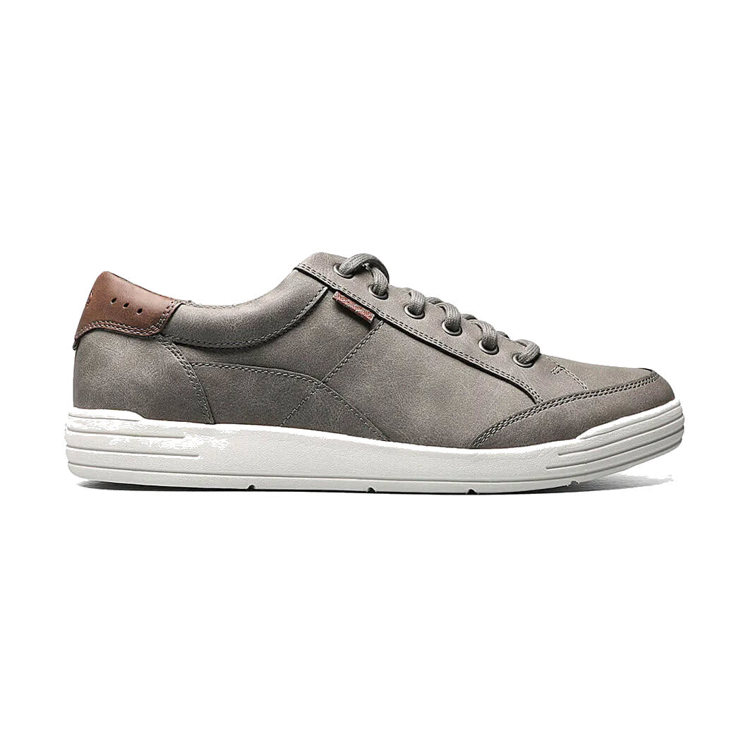 A single Nunn Bush KORE City Walk Lace Oxford Charcoal - Mens sneaker with breathable mesh linings, a white sole, and brown leather detailing on the heel, shown from the side on a white background.