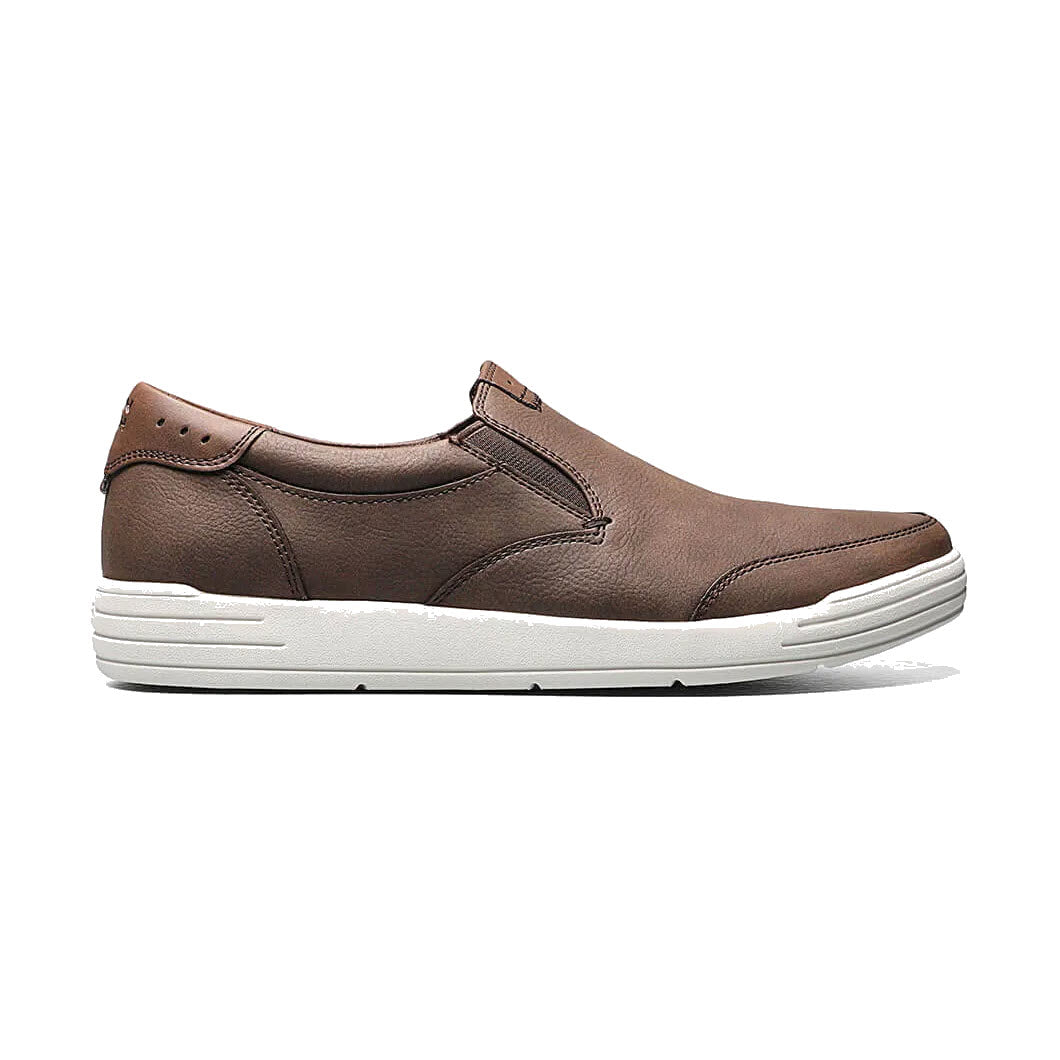 Brown leather Nunn Bush Kore City Walk Slip-On shoe with white soles, displayed against a white background.