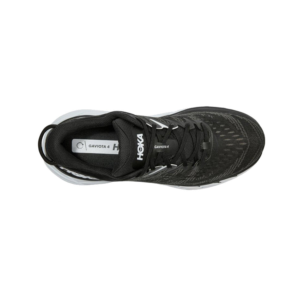 Top view of a black HOKA GAVIOTA 4 BLACK/WHITE - WOMENS running shoe designed for overpronators, on a white background.