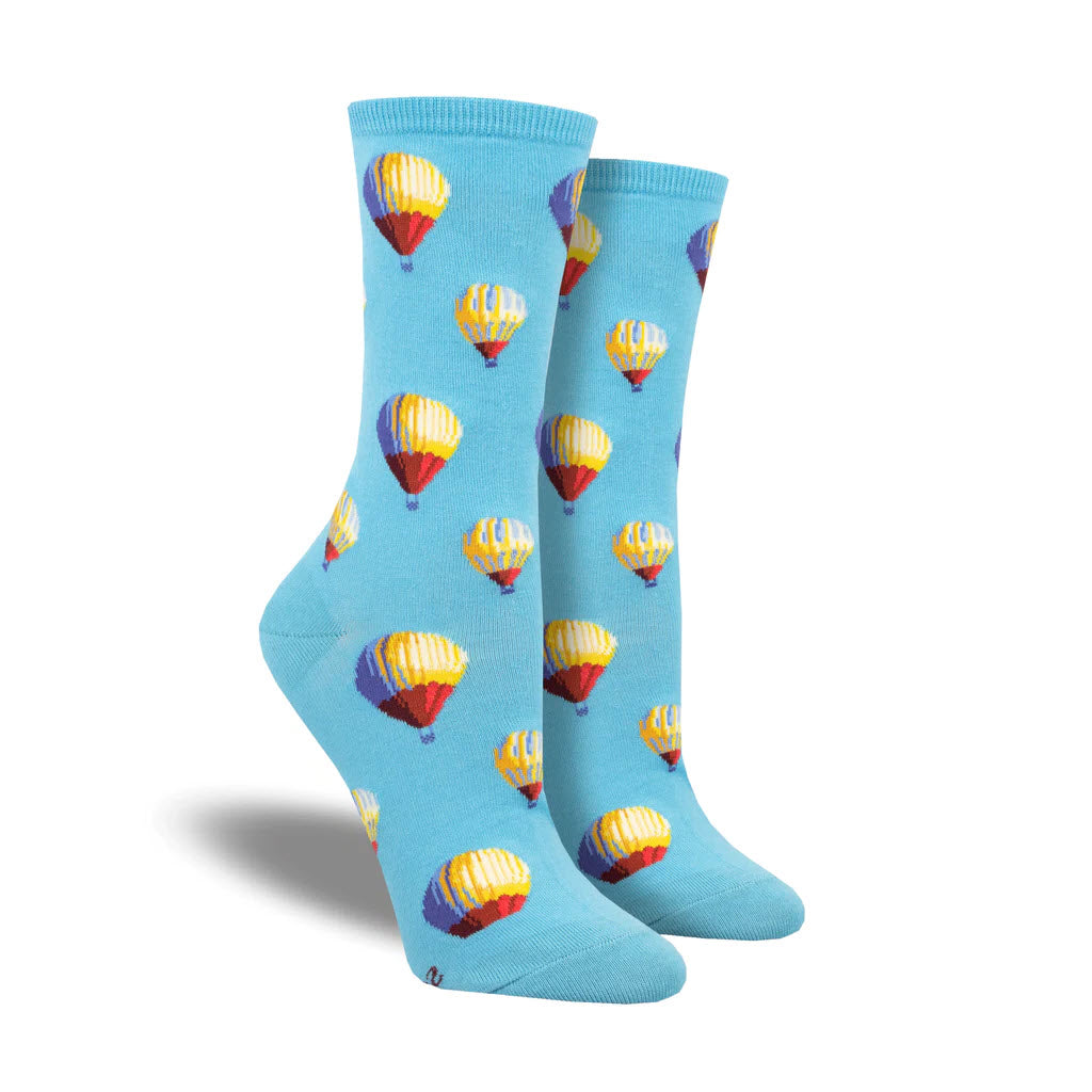 A pair of SOCKSMITH HOT AIR CREW SOCKS BLUE, from Socksmith, with a colorful hot air balloon pattern, displayed upright against a white background.