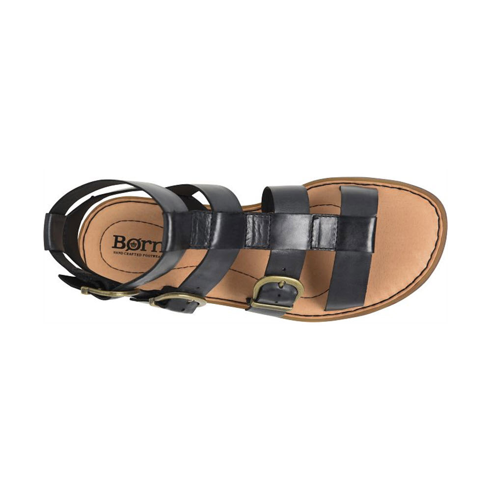 Born Haidee Black gladiator sandal with a buckle, displaying the &quot;Born&quot; brand logo on the insole, isolated on a white background.