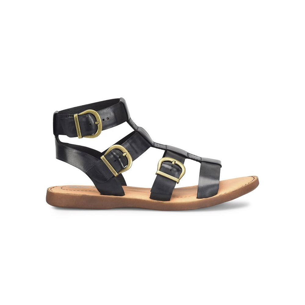 A pair of Born Haidee Black gladiator sandals with buckles and a flat sole on a white background.