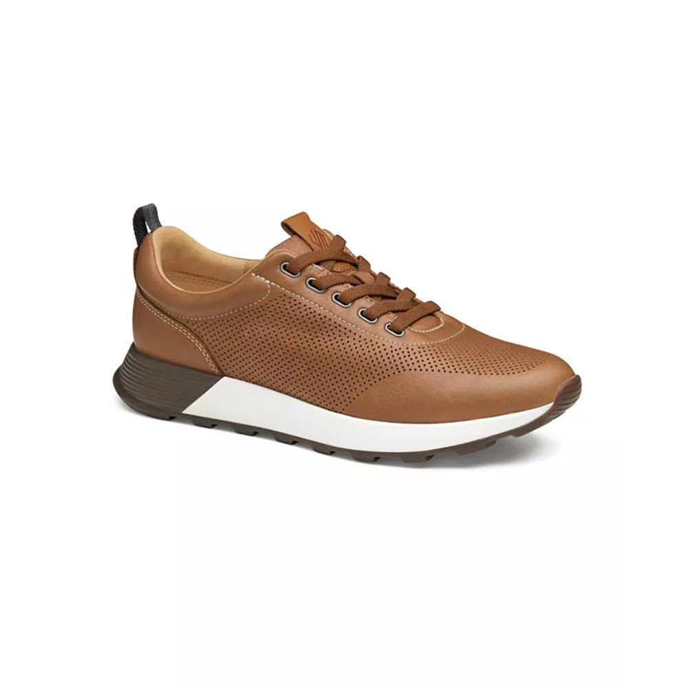 A Johnston &amp; Murphy Kinnon Pered Jogger Tan sneaker with perforated upper and a thick flexible rubber sole, displayed on a plain white background.