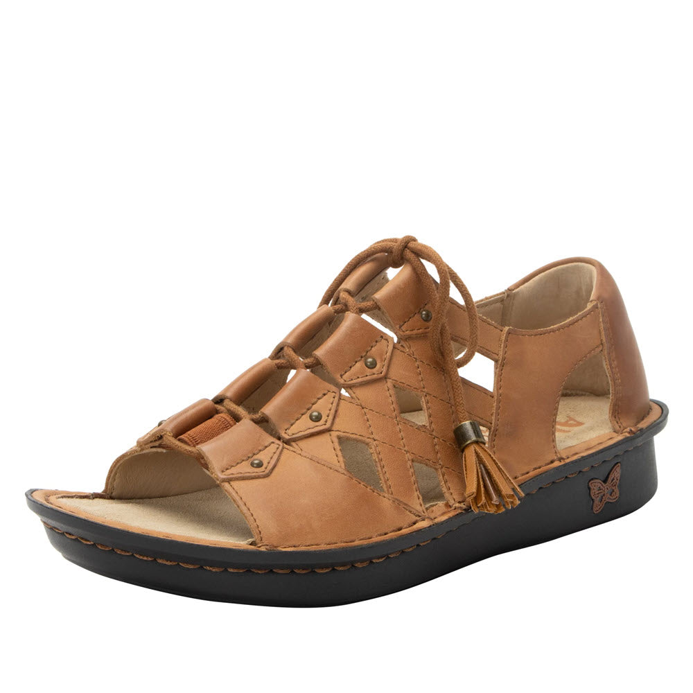 A Alegria Valerie Cognac - Womens leather wedge sandal with crisscross straps and a tassel, featuring a memory foam footbed, displayed on a white background.