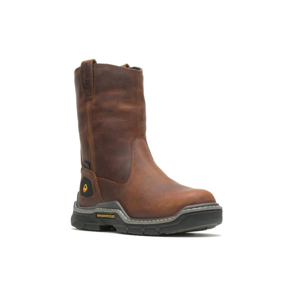 A single brown leather Wolverine Raider work boot with a pull tab on a white background.