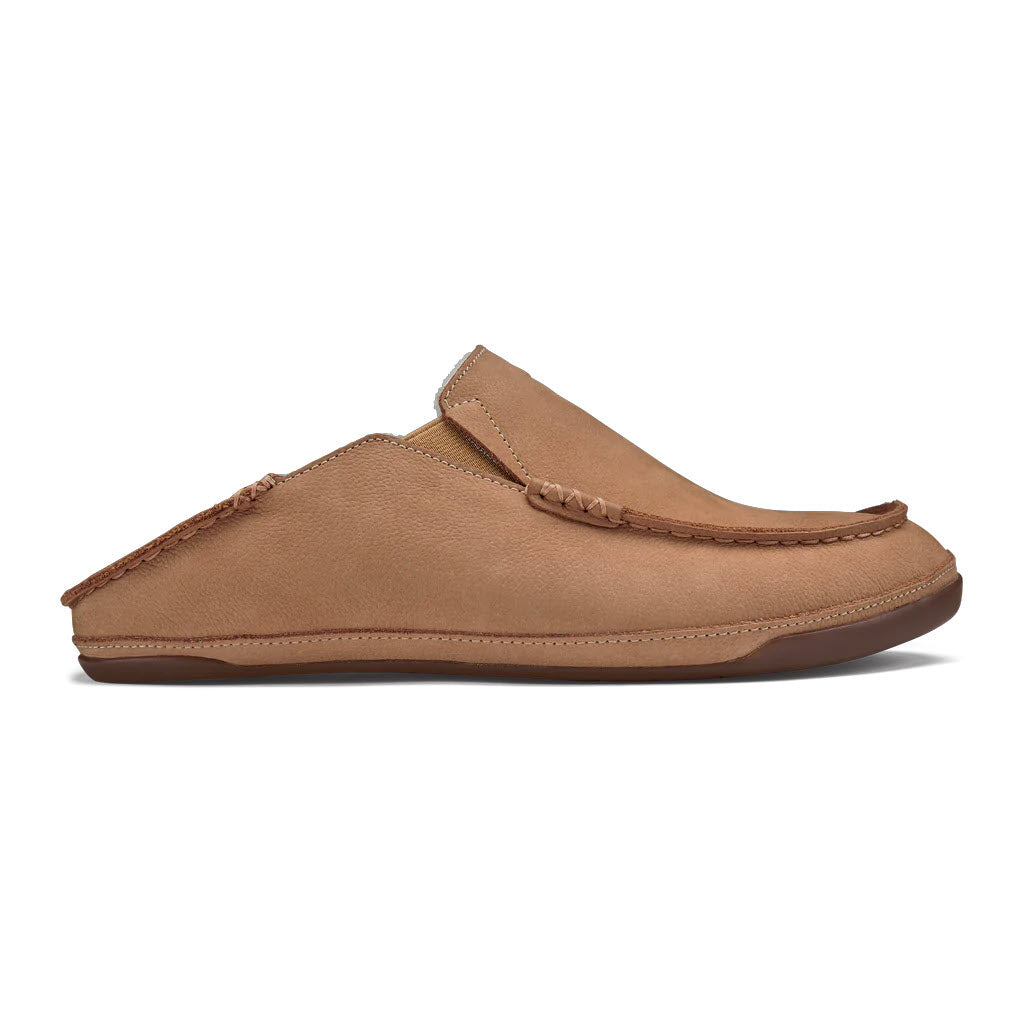 A single OLUKAI KIPUKA HULU SLIPPER NATURAL/NATURAL - MENS moccasin shoe with stitching details and a strap across the top, displayed on a plain white background.