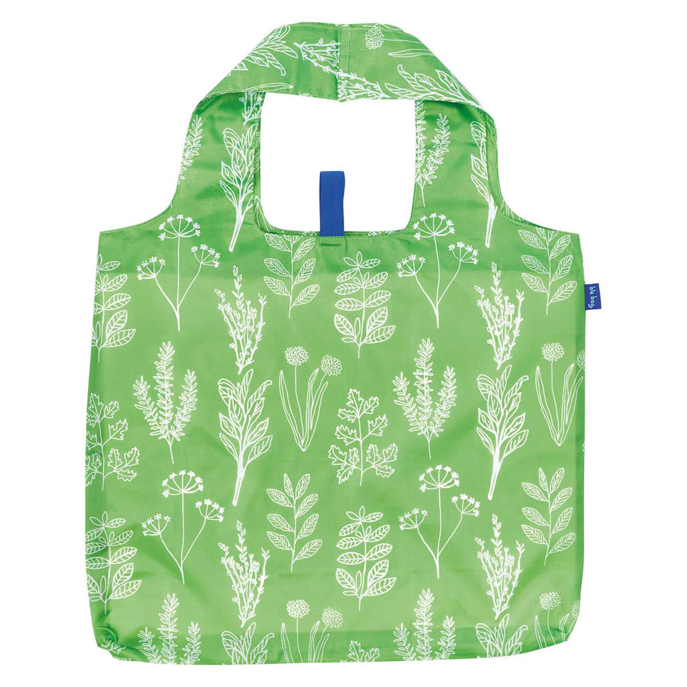 A green reusable ROCKFLOWERPAPER BLU BAG HERBS with a white botanical print, featuring a variety of plants and leaves, and a blue handle on top.