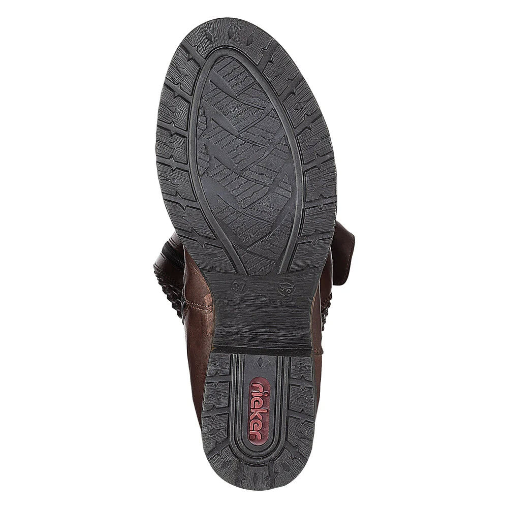 Bottom view of a brown Rieker sandal showing the woven pattern on the sole.