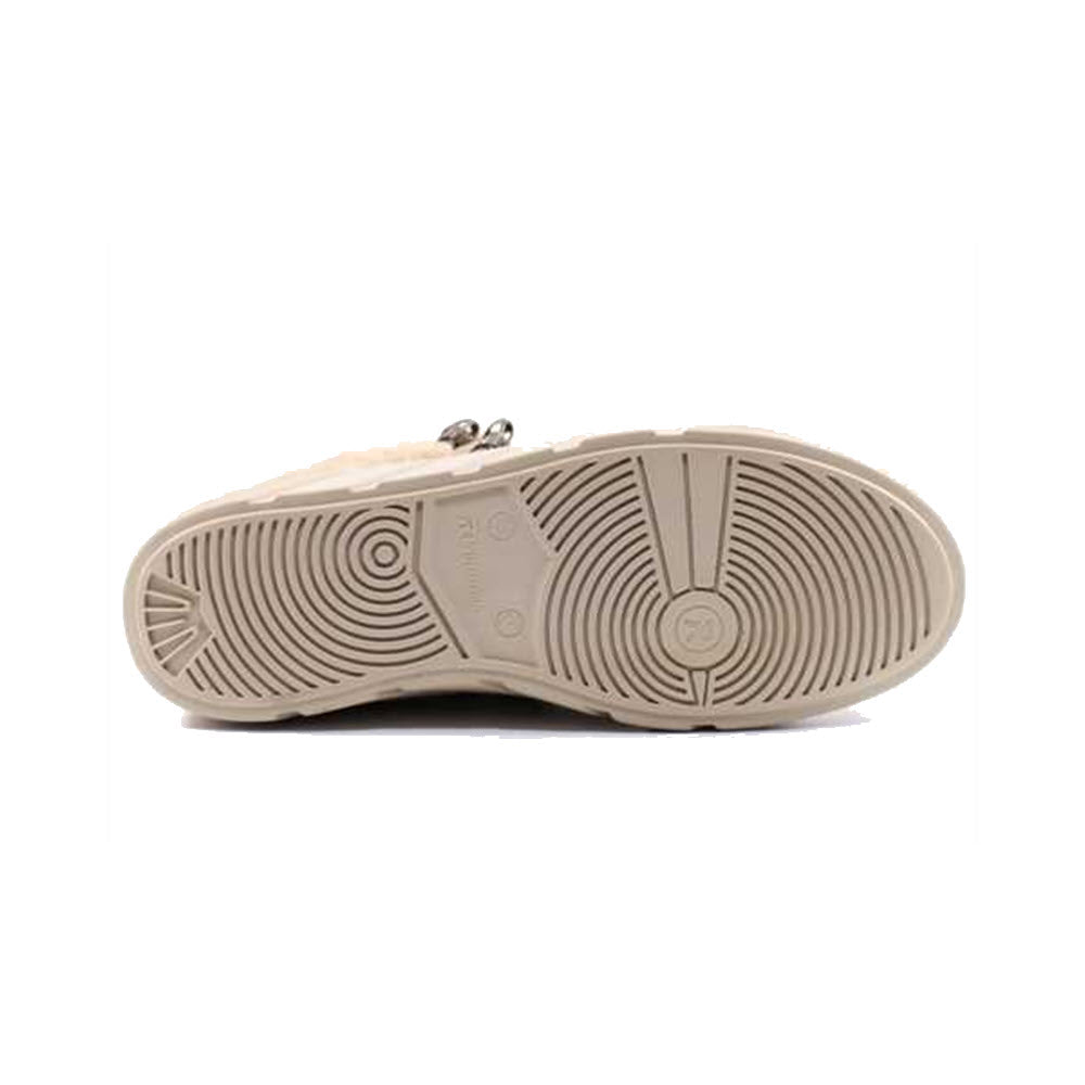 Sole of a taupe Revolution shoe with circular tread patterns and a visible brand logo, photographed against a white background.