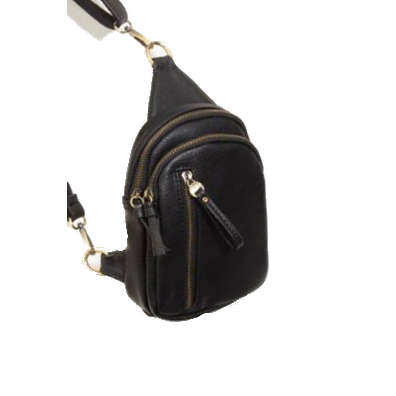 JOY SUSAN SKYLAR SLING BLACK vegan leather sling bag with multiple zippers hanging against a white background.