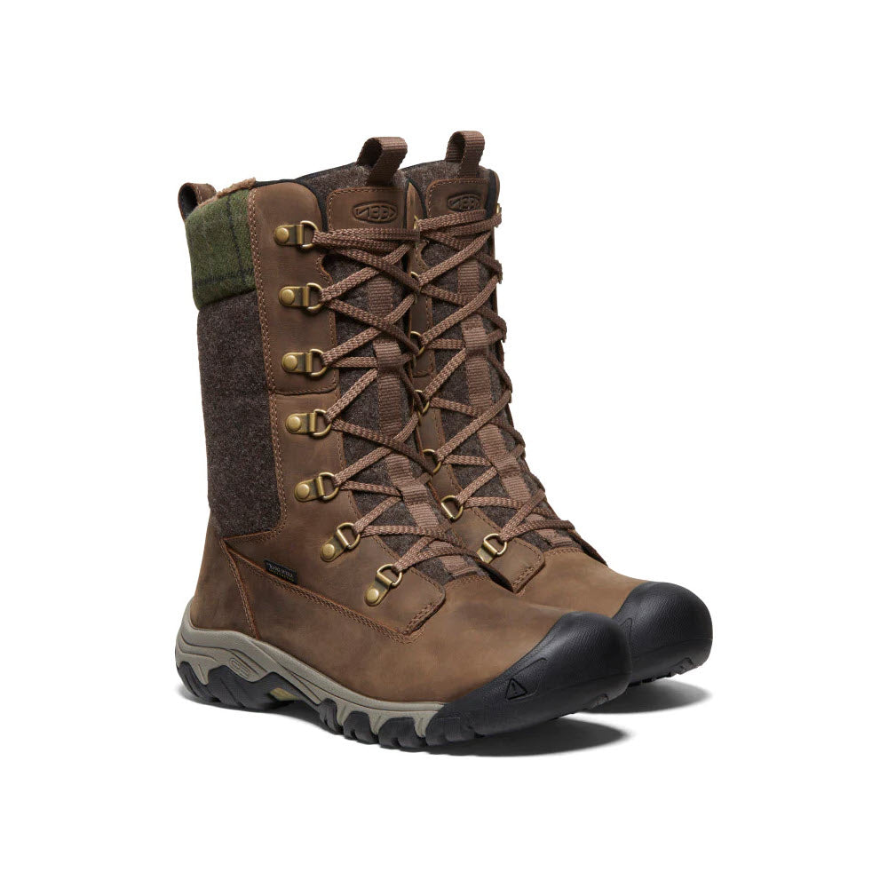 A single Keen Greta Tall Boot Dark Earth hiking boot with green detailing, featuring a high-top design and rugged tread for cold-weather traction, displayed against a white background.