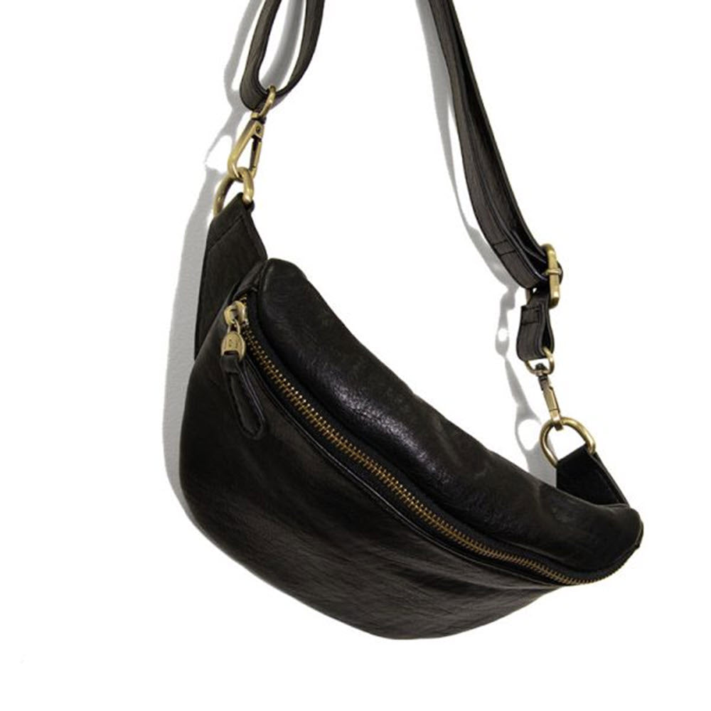 A black JOY SHILOH SLING-BELT BAG BLACK vegan leather crossbody bag with a silver zipper and adjustable strap, displayed against a white background.