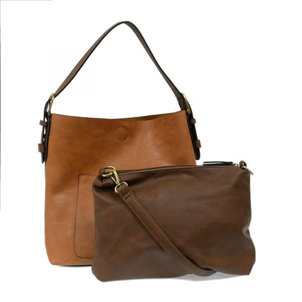 Two JOY SUSAN HOBO BAG HAZELNUT in brown and tan with adjustable straps displayed against a white background.