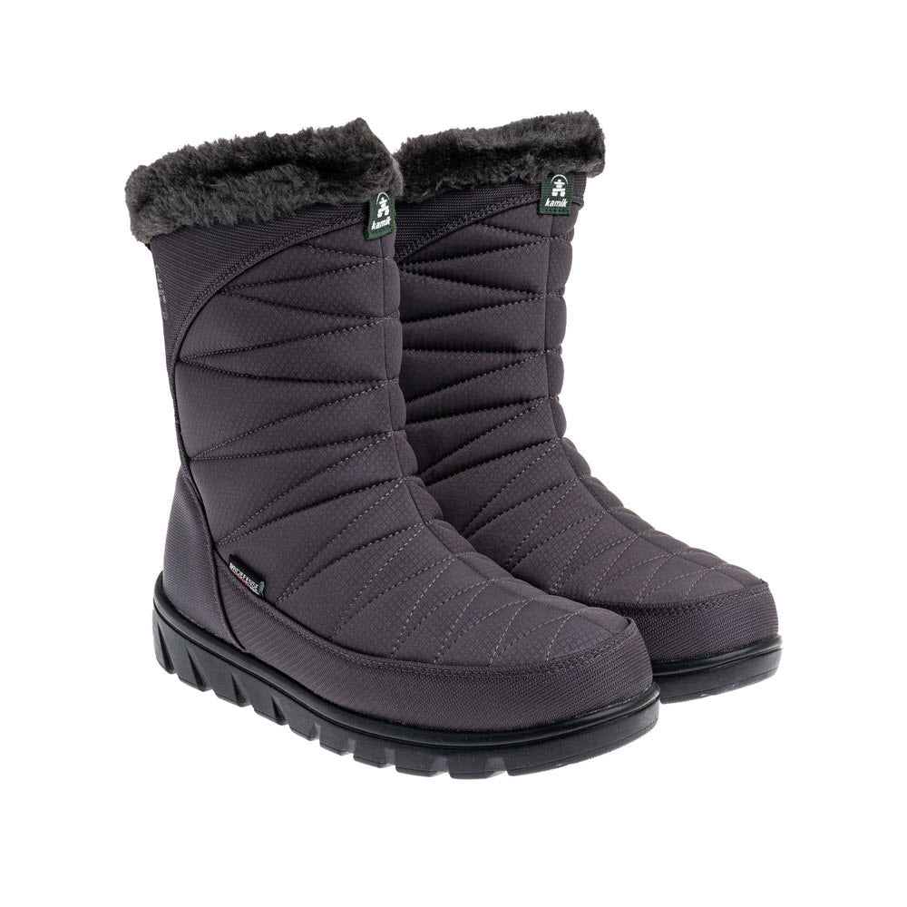 A pair of Kamik Hannah Zip Charcoal women&#39;s waterproof quilted winter boots with fur trim and thick rubber soles, isolated on a white background.