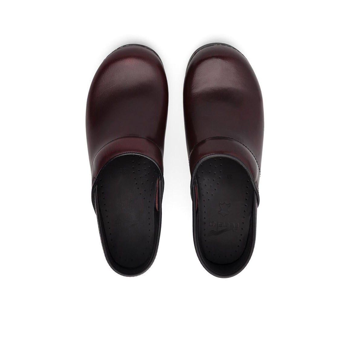 A pair of dark red Dansko Professional Cordovan Cabrio clogs viewed from above on a white background.