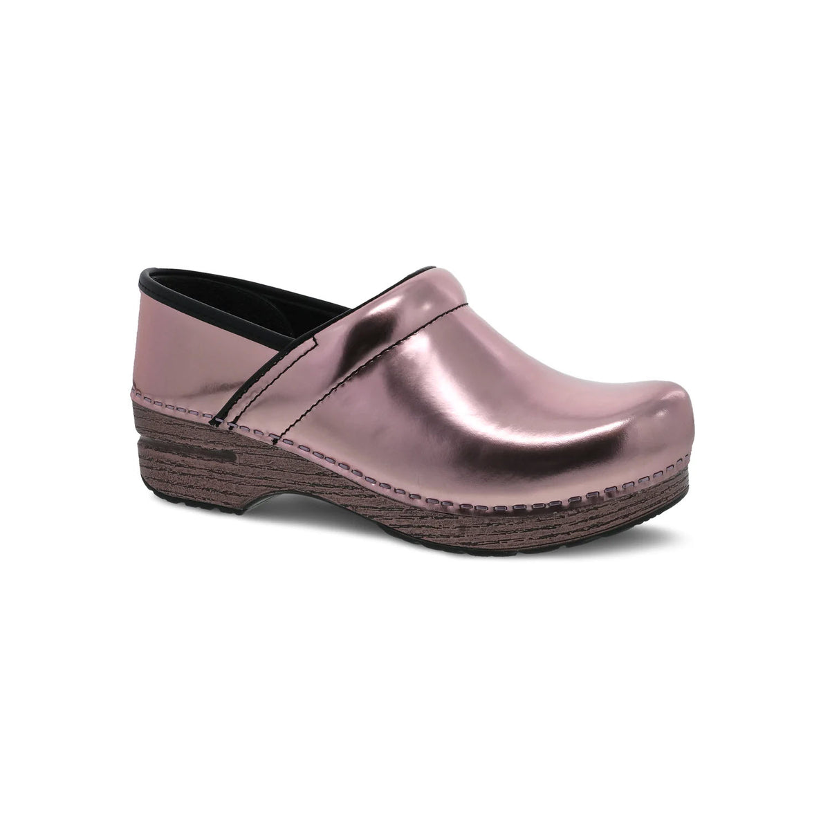A Dansko metallic pink professional clog with a black interior and a wooden sole, isolated on a white background.